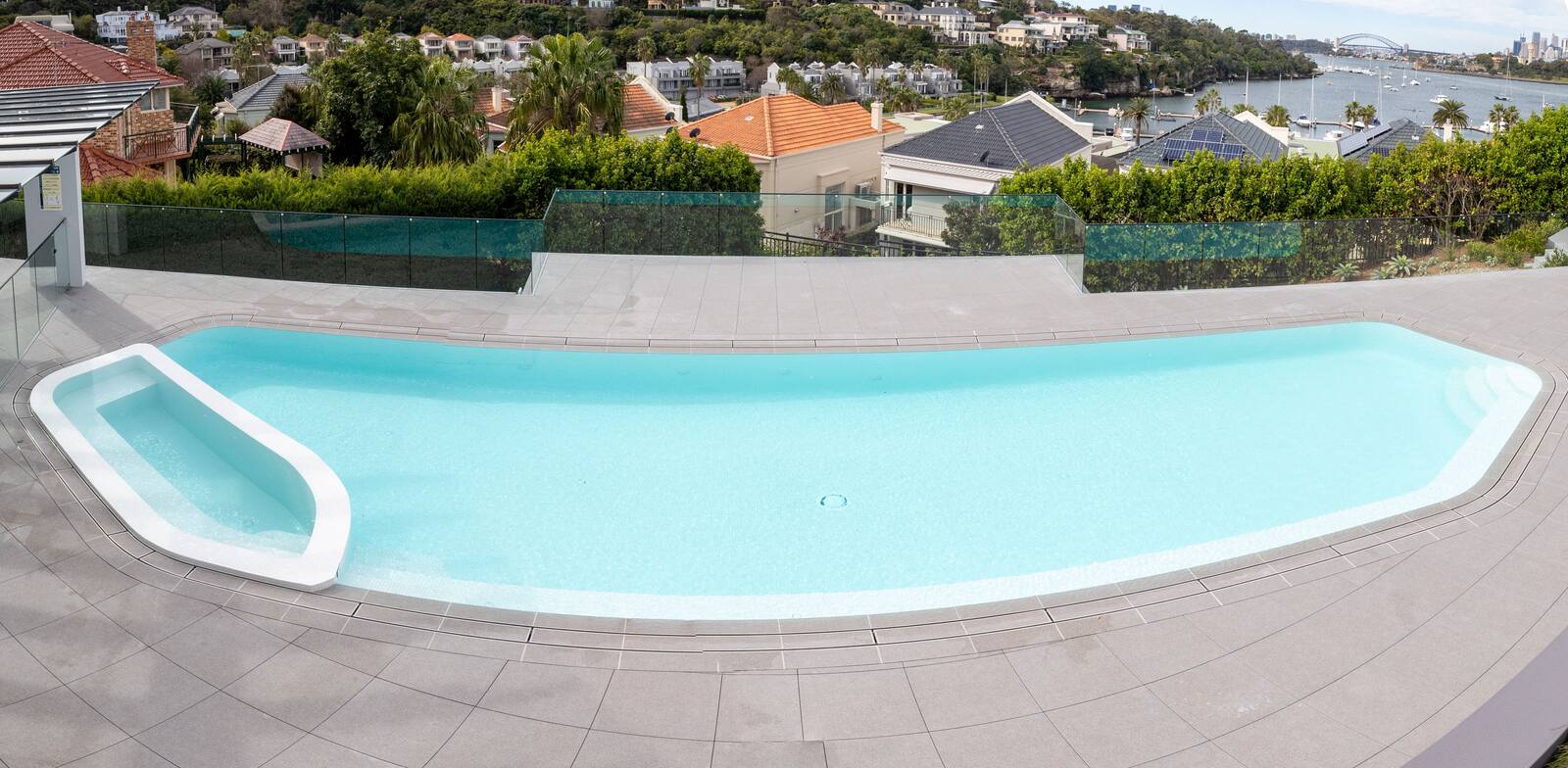 Freeform pool on a harbour headland, Pulpit Point