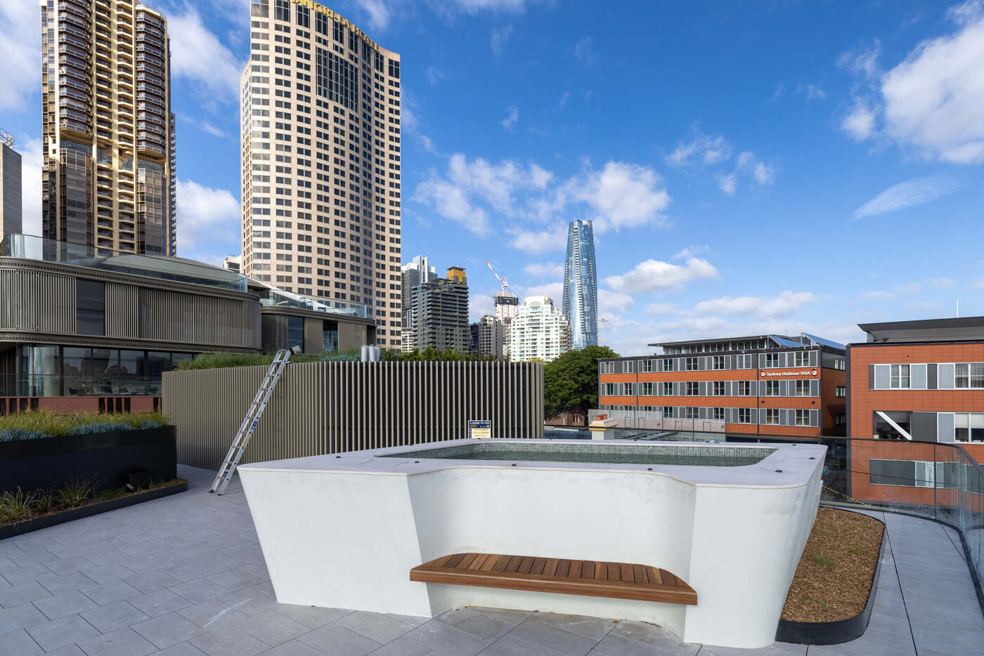 Raised spa with built-in timber bench and Sydney tower views, Harrington Street
