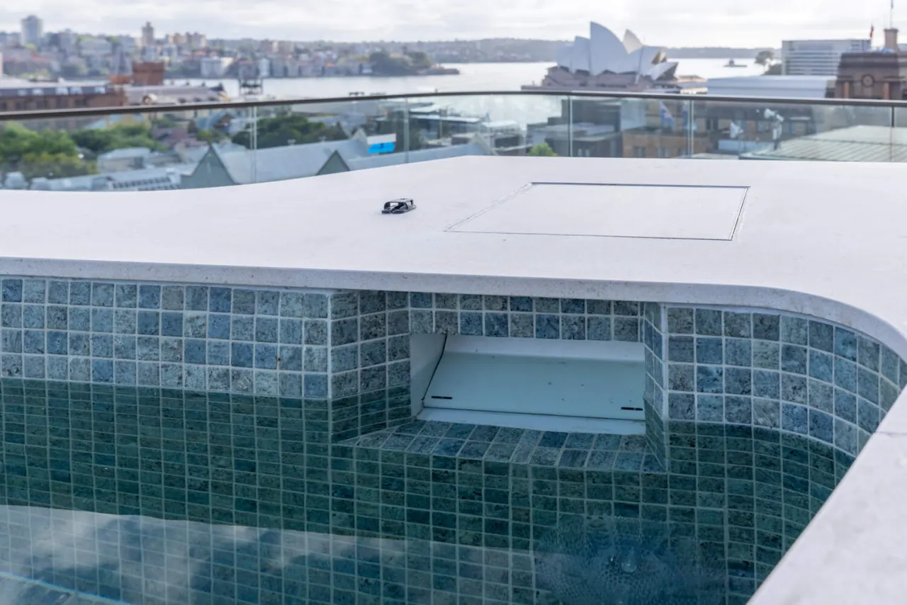 Sea-green glass mosaic detail with flush cover recess, Harrington Street rooftop pool