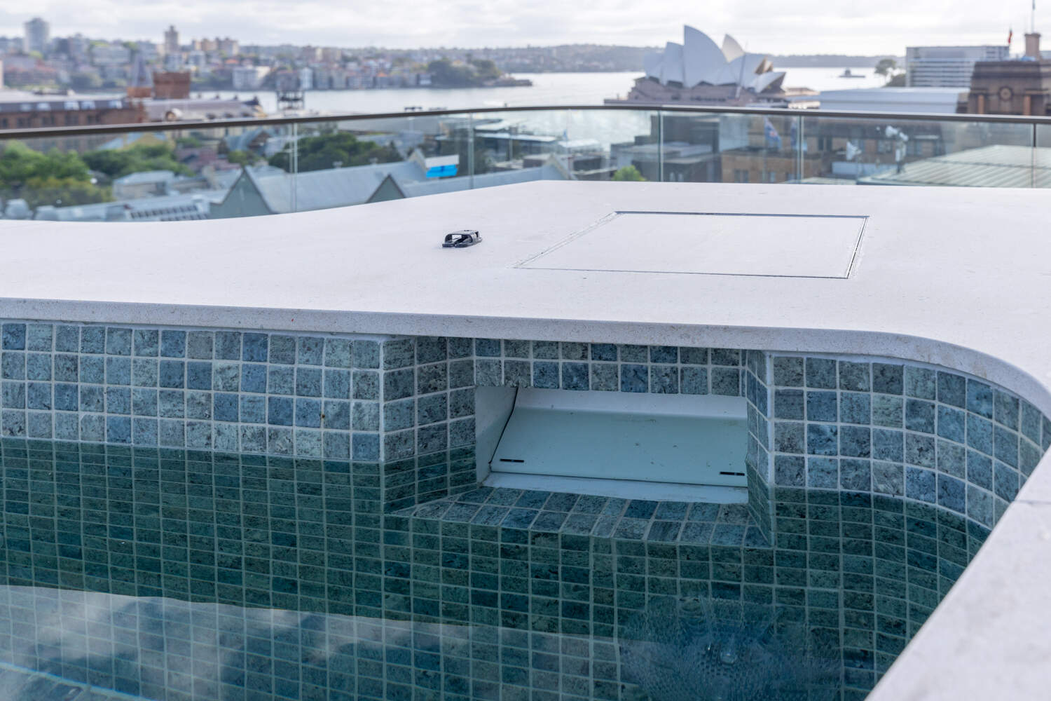 Sea-green glass mosaic detail with flush cover recess, Harrington Street rooftop pool