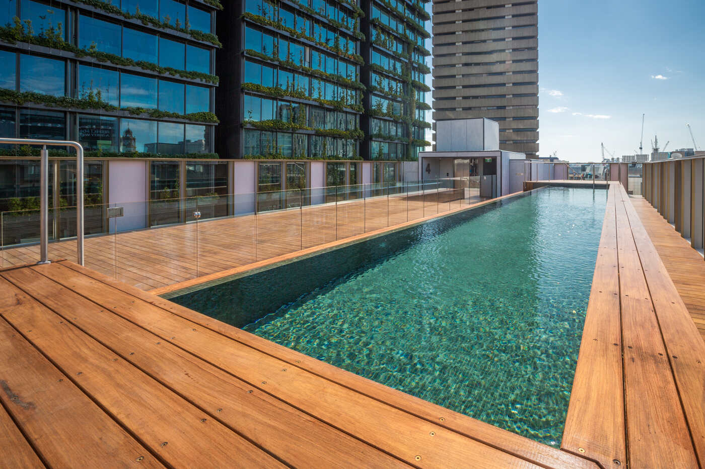 Teal mosaic pool and glass balustrade, Old Clare Hotel