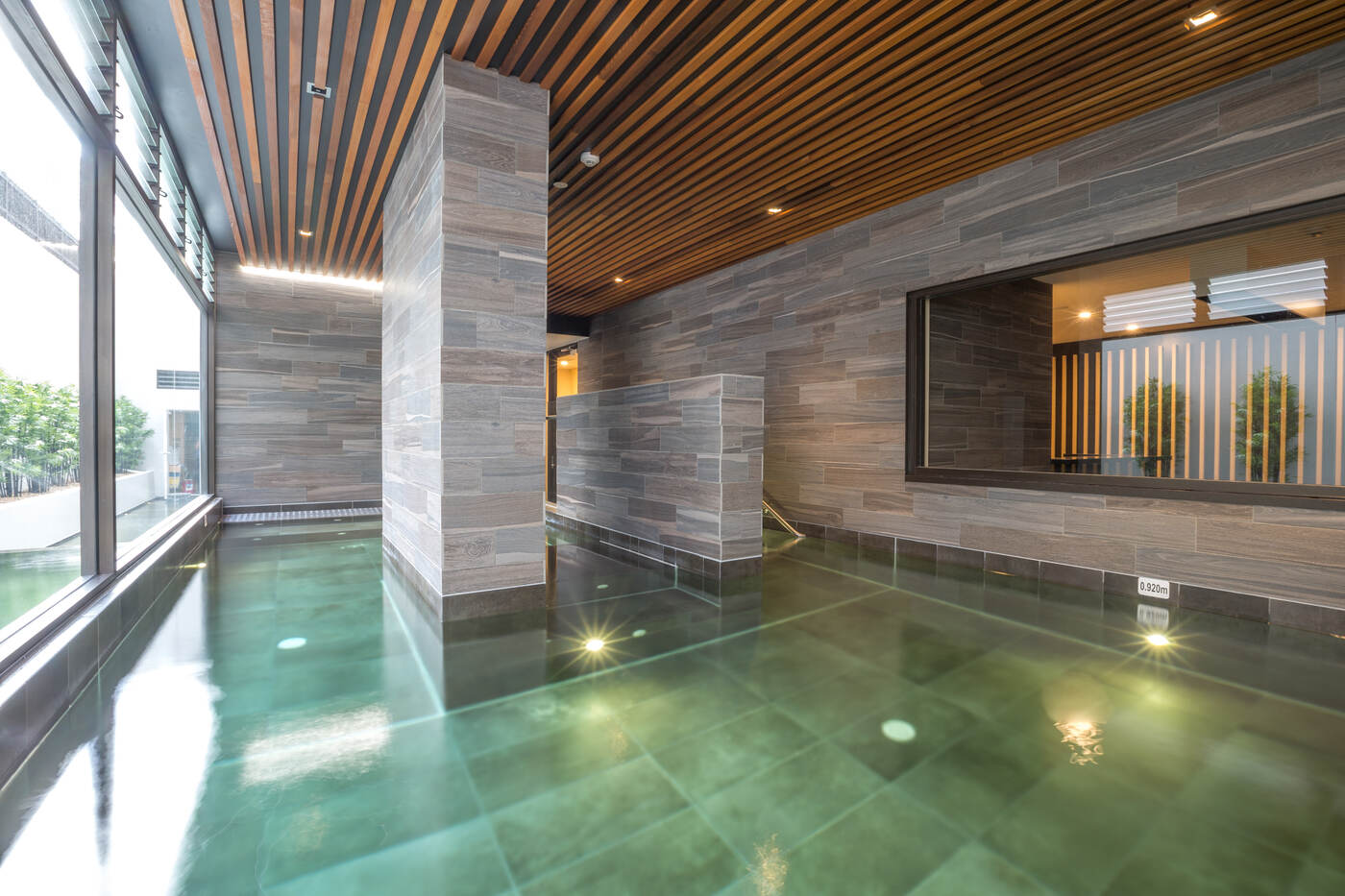 Spa and stone wall detail, Platinum Apartments Zetland