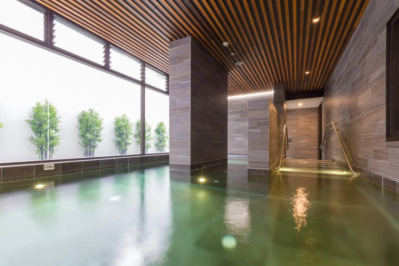 Spa corner with lit rail, Platinum Apartments Zetland