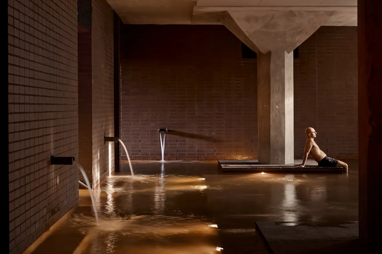 Large mineral pool with wall spouts and a warehouse column, Sense of Self, Surry Hills