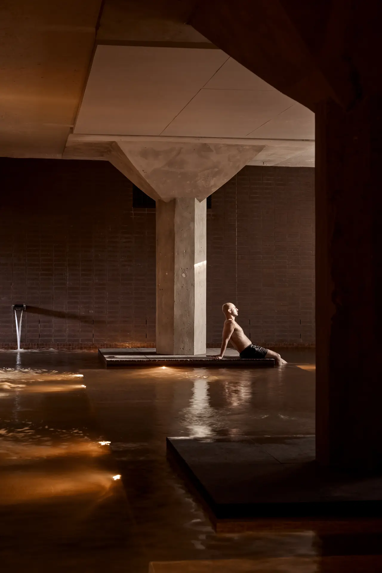 Bather beside the wall spouts in the large mineral pool, Sense of Self