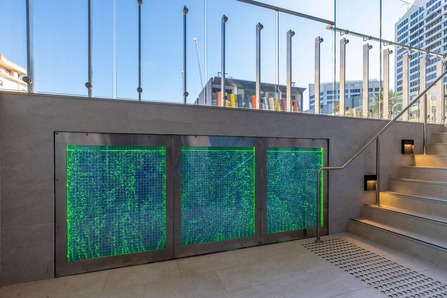 Backlit green glass water feature at street level, Sussex Street
