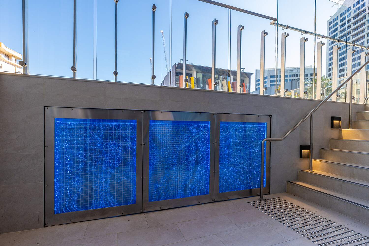 Backlit blue glass water feature, Sussex Street