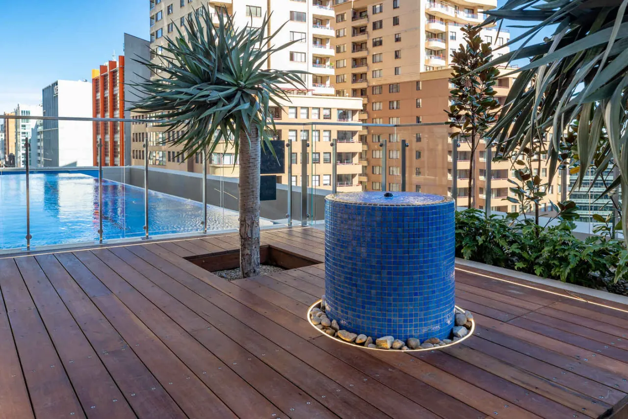 Blue mosaic water feature on the timber deck, Sussex Street rooftop