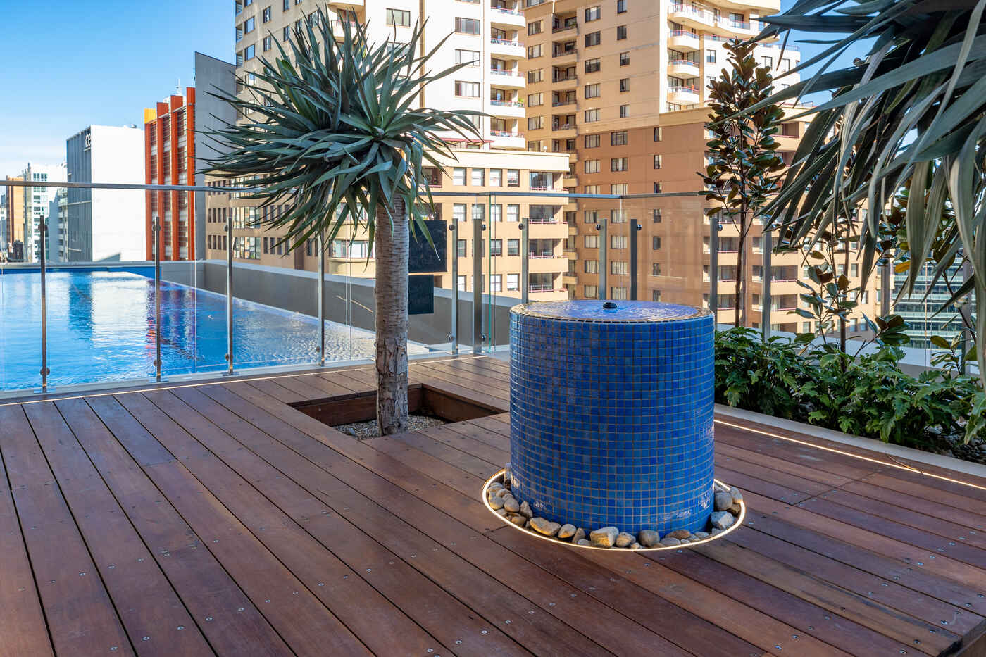 Blue mosaic water feature on the timber deck, Sussex Street rooftop