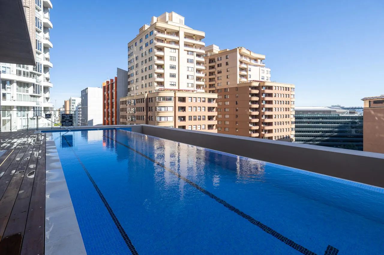 Infinity edge mirroring the city skyline, Sussex Street rooftop pool