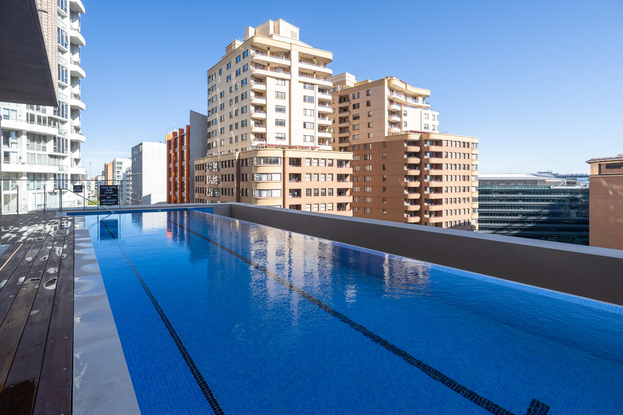 Infinity edge mirroring the city skyline, Sussex Street rooftop pool