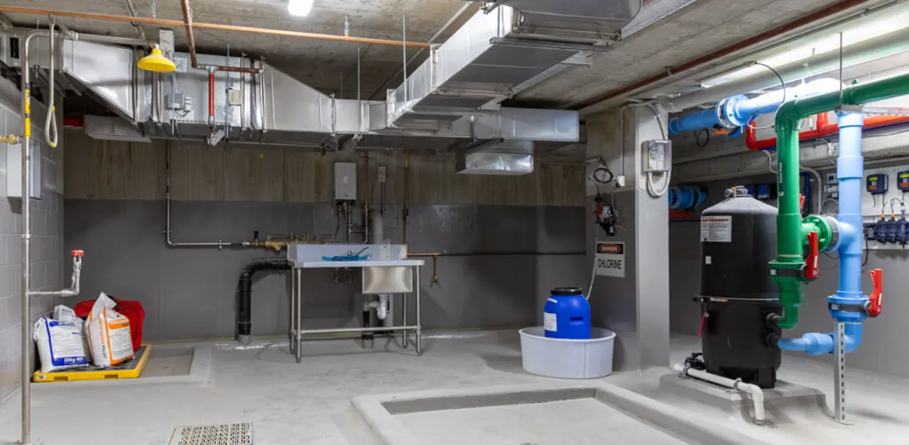 Commercial plant room with ductwork and pipework, Vela Apartments