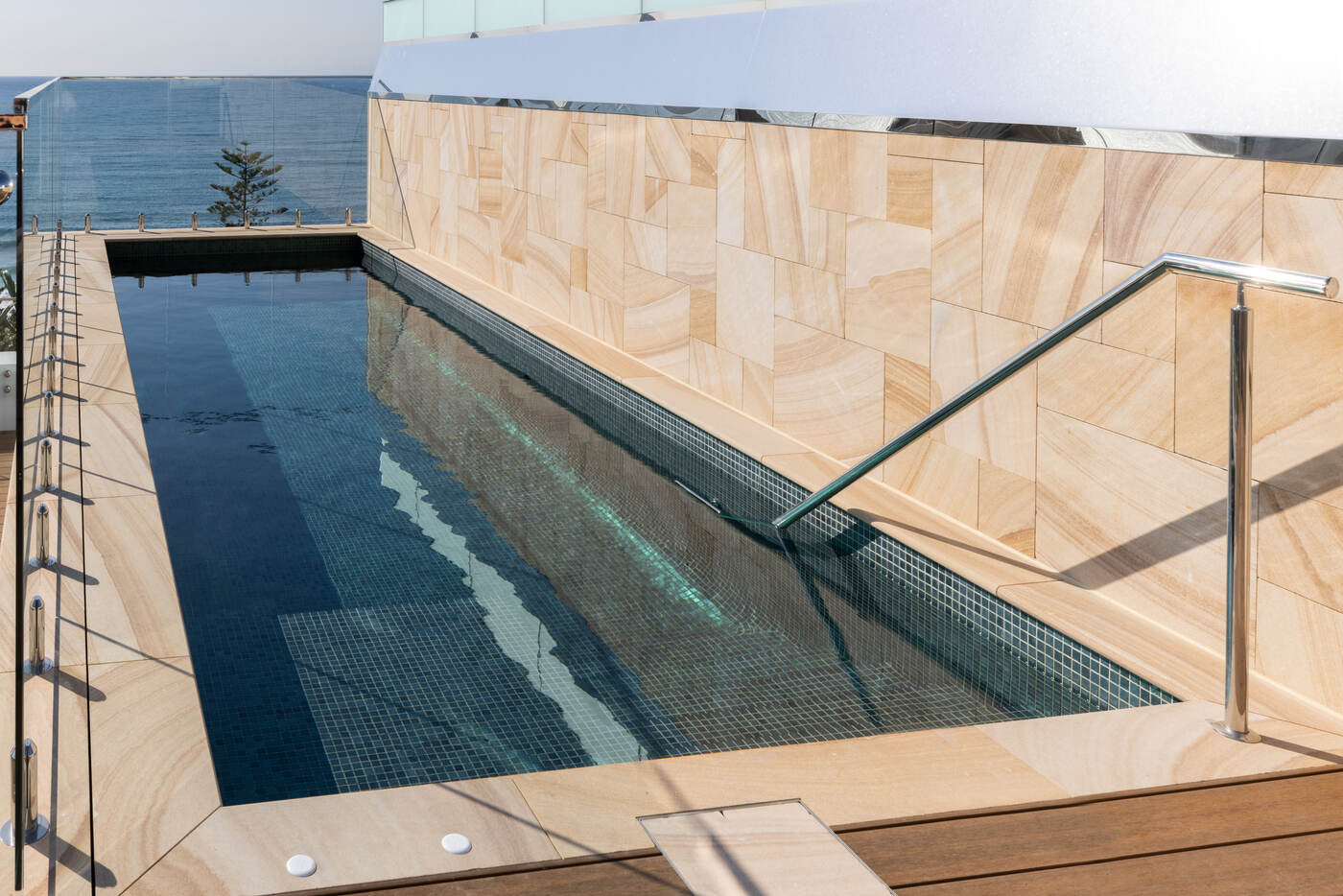 Penthouse pool and sandstone feature wall, Wavelengths Cronulla