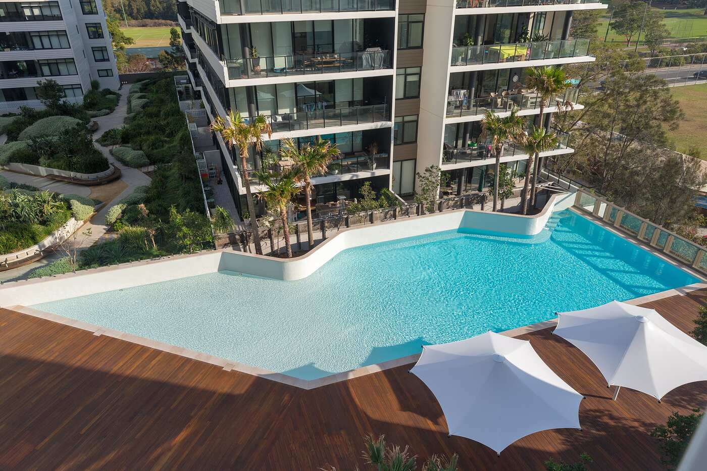 Resort podium pool with sun umbrellas, Woolooware Bay Stage 2
