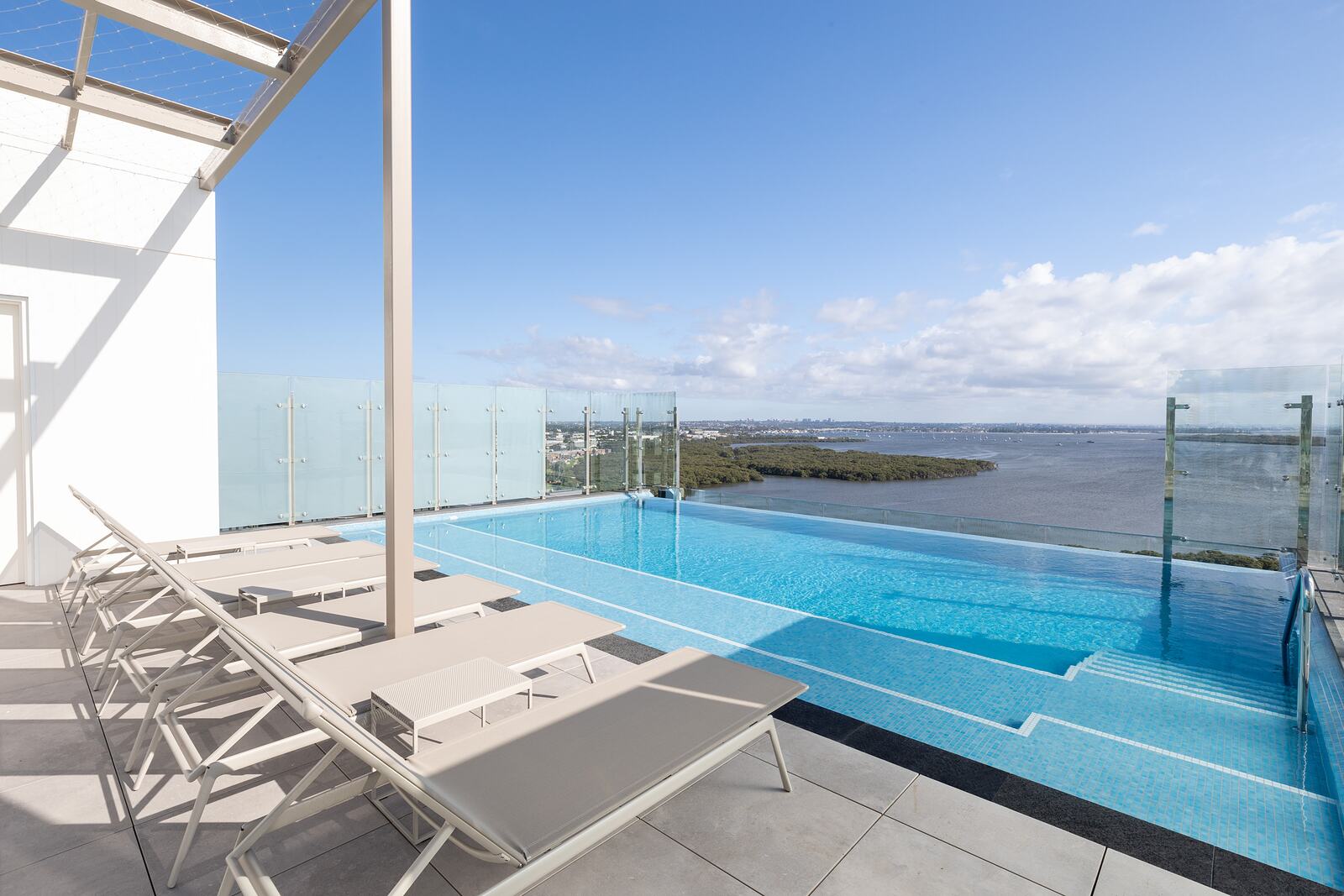 Rooftop pool with sun lounges over the bay, Woolooware Bay Stage 3